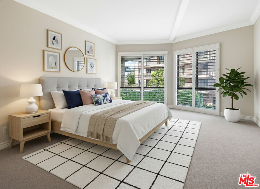 11808 Dorothy Street, Unit 206 Los Angeles, CA 90049 - Photo 1 of 33 a bedroom with a large bed and a large window