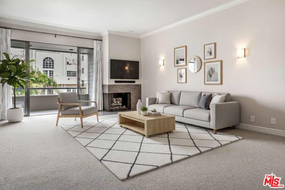 11808 Dorothy Street, Unit 206 Los Angeles, CA 90049 - Photo 11 of 33 a living room with furniture a flat screen tv and a fireplace