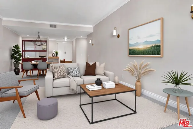 a living room with furniture and a painting on the wall