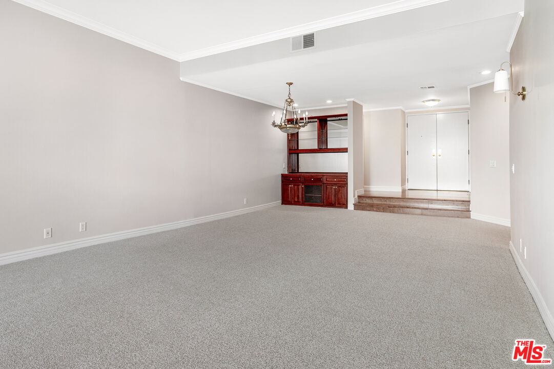 11808 Dorothy Street, Unit 206 Los Angeles, CA 90049 - Photo 21 of 33 an empty room with shelves