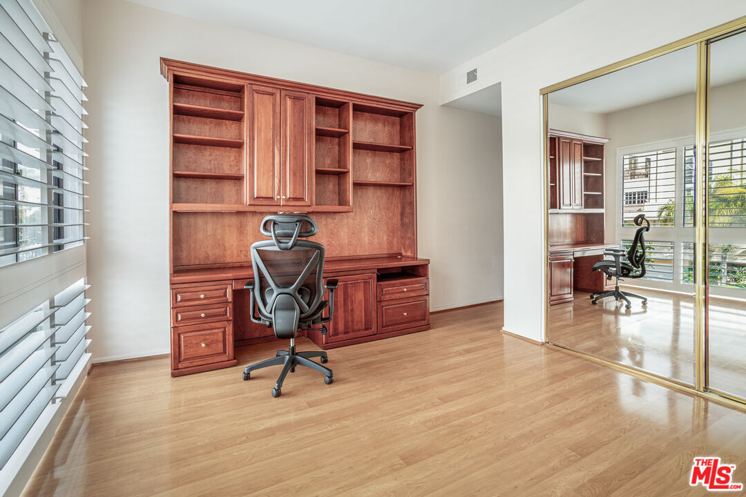 11808 Dorothy Street, Unit 206 Los Angeles, CA 90049 - Photo 26 of 33 a view of a workspace with furniture and lounge chair