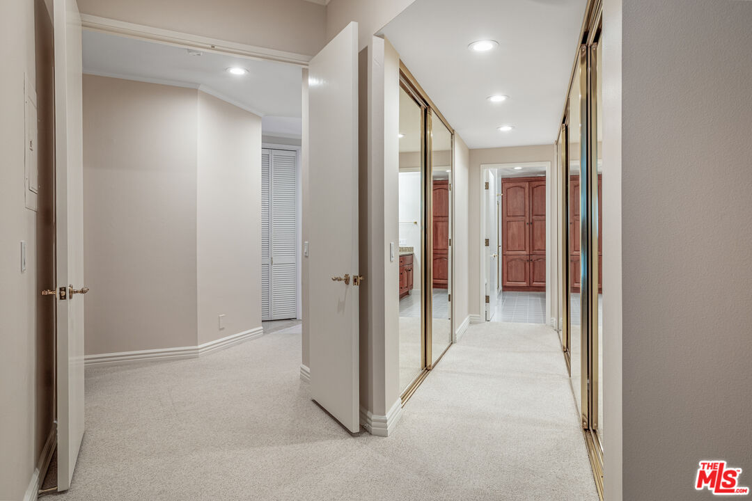 11808 Dorothy Street, Unit 206 Los Angeles, CA 90049 - Photo 8 of 33 a view of a hallway with closet and a bathroom