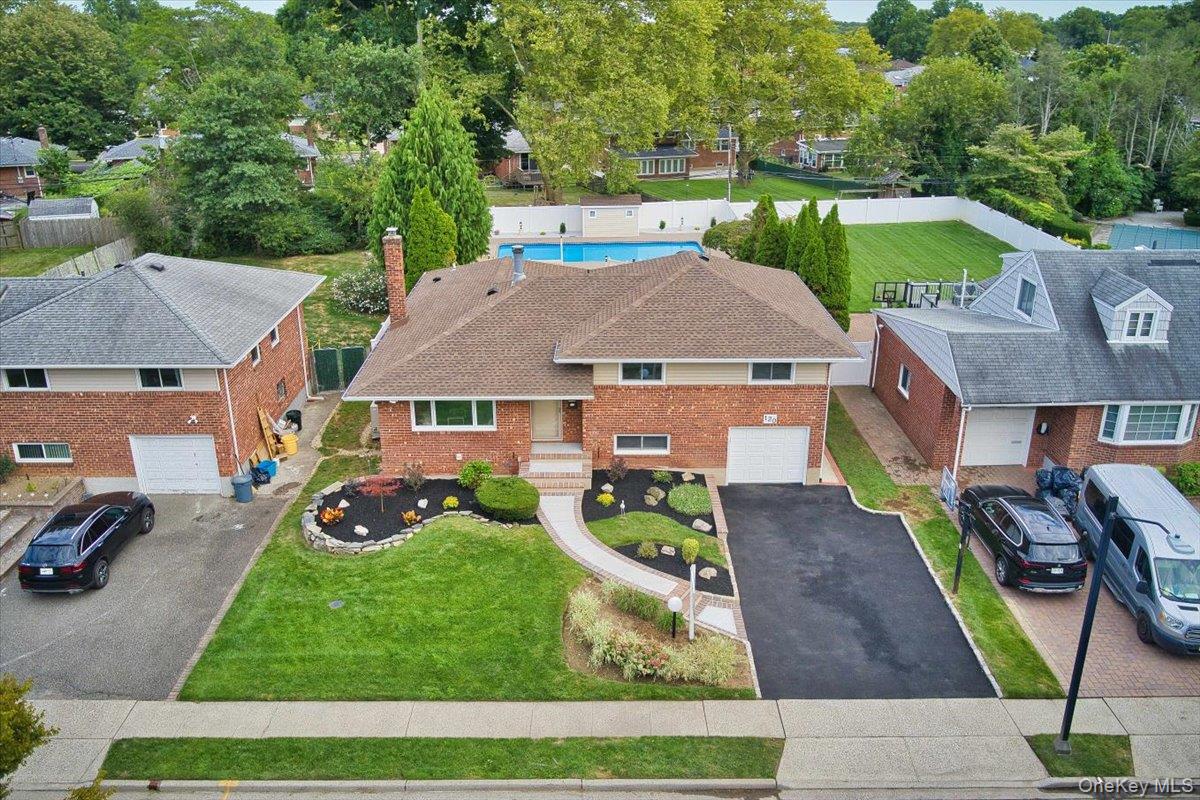 an aerial view of a house with garden space
