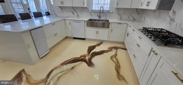 a living room with furniture and a ceiling fan