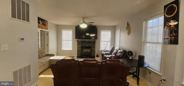 a view of staircase with railing and white walls