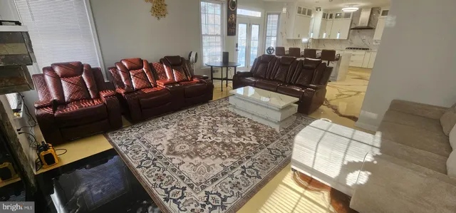 a view of an entryway with wooden floor