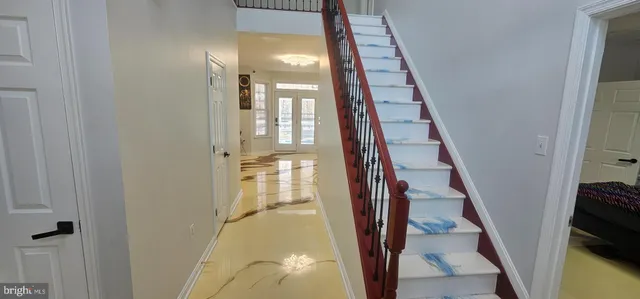 a bathroom with a double vanity sink toilet and shower