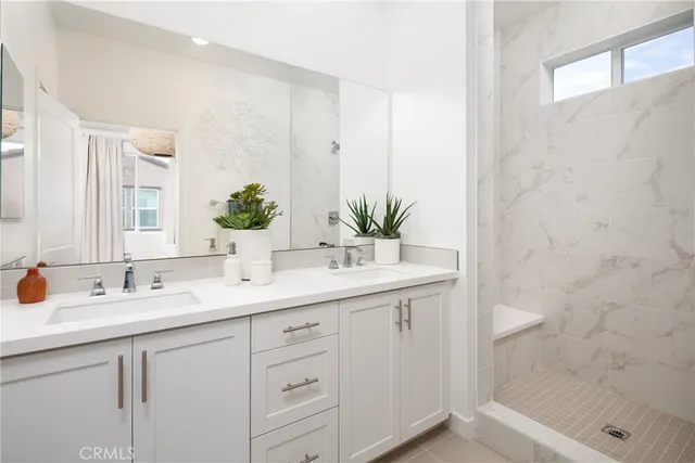 a bed room with a bed and a potted plant