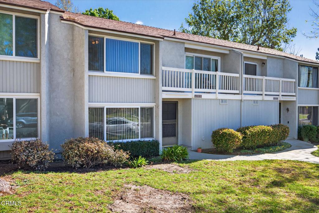 6508 Penn Street, Unit B Moorpark, CA 93021 - Photo 2 of 27 a house with a flower garden in front of it