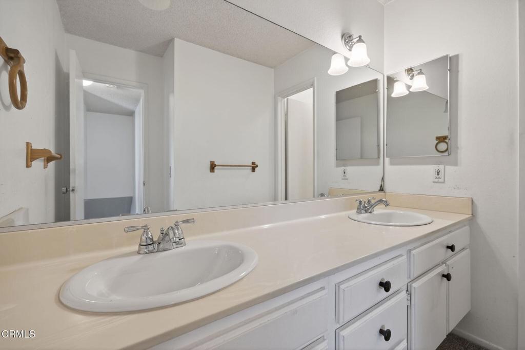 6508 Penn Street, Unit B Moorpark, CA 93021 - Photo 21 of 27 a bathroom with a sink and a mirror