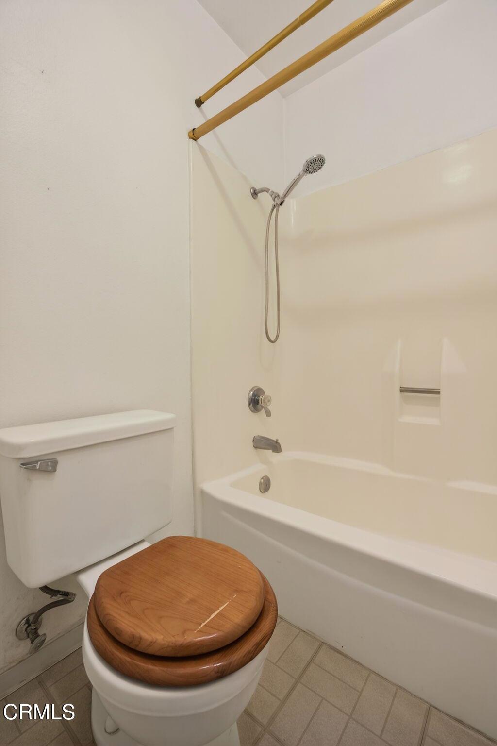 6508 Penn Street, Unit B Moorpark, CA 93021 - Photo 22 of 27 a bathroom with a toilet and a bath tub