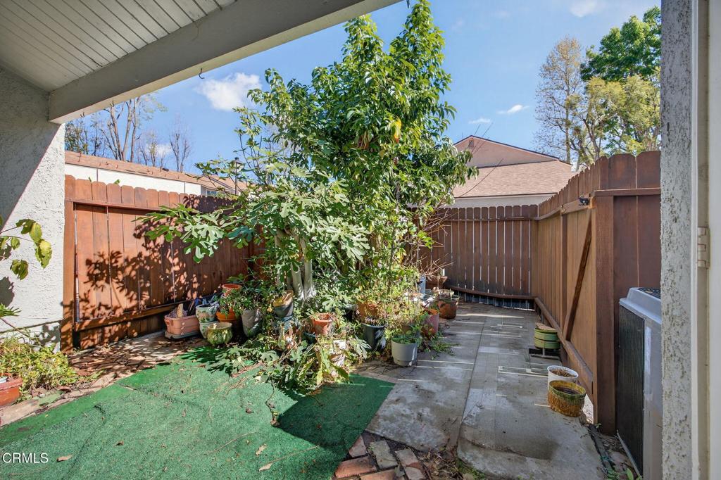 6508 Penn Street, Unit B Moorpark, CA 93021 - Photo 25 of 27 a view of a backyard with flowers