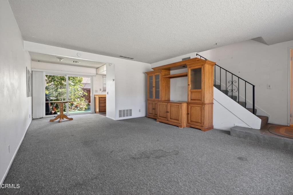 6508 Penn Street, Unit B Moorpark, CA 93021 - Photo 7 of 27 a view of an empty room with windows
