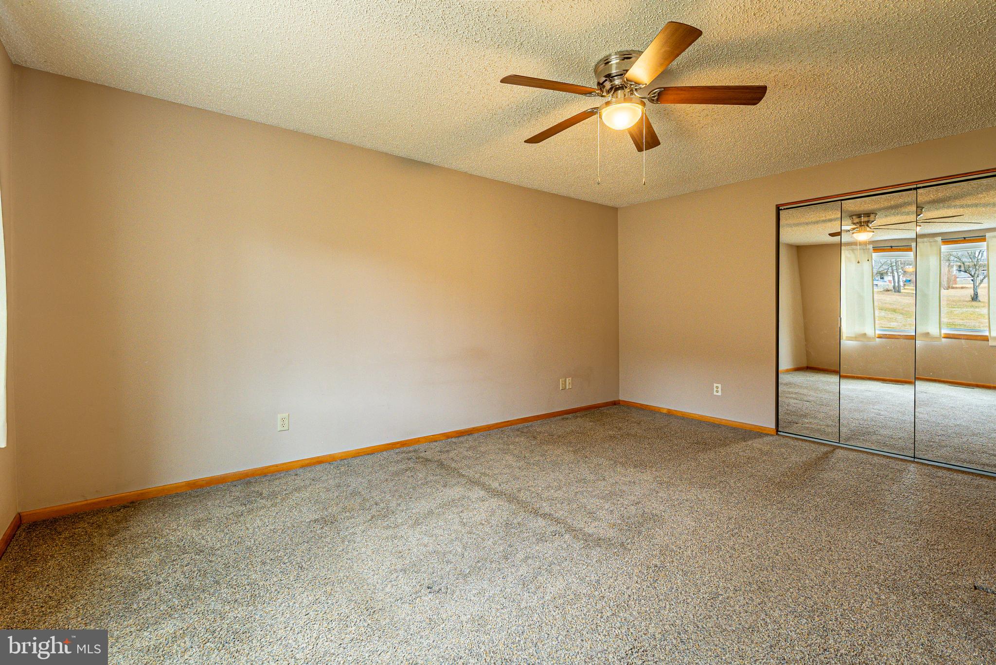 13604 Bedford Road Northeast Cumberland, MD 21502 - Photo 16 of 37 an empty room with fan