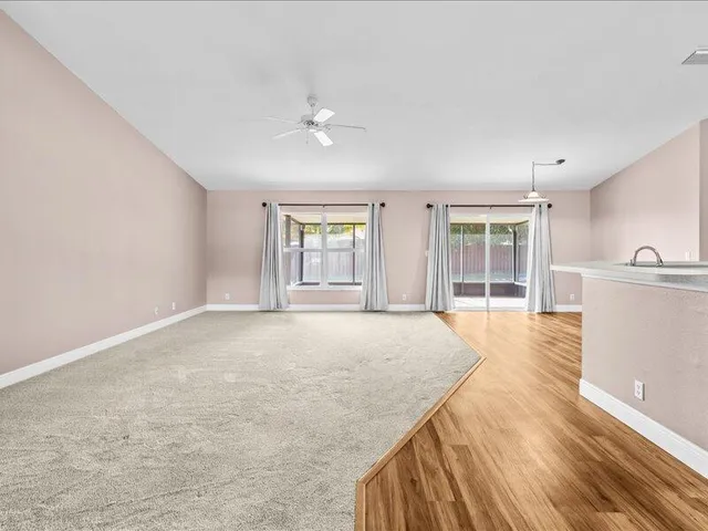 a view of a kitchen with a sink and a window
