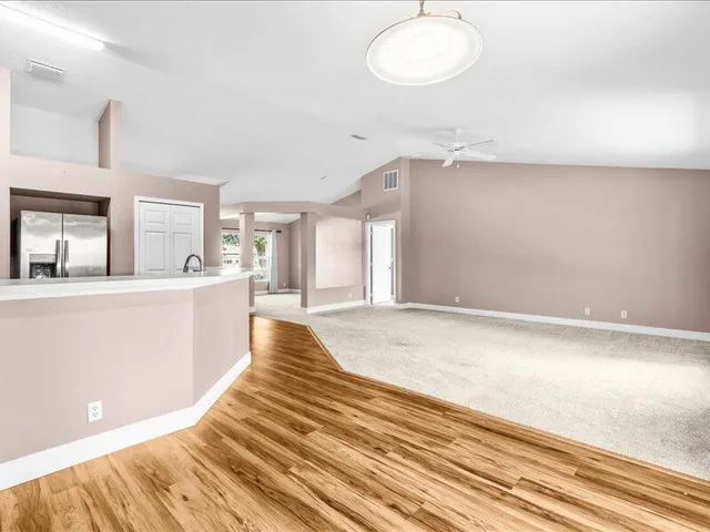 a kitchen with granite countertop a stove top oven and sink
