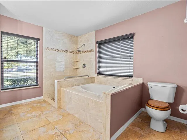 a bathroom with a shower and a shower