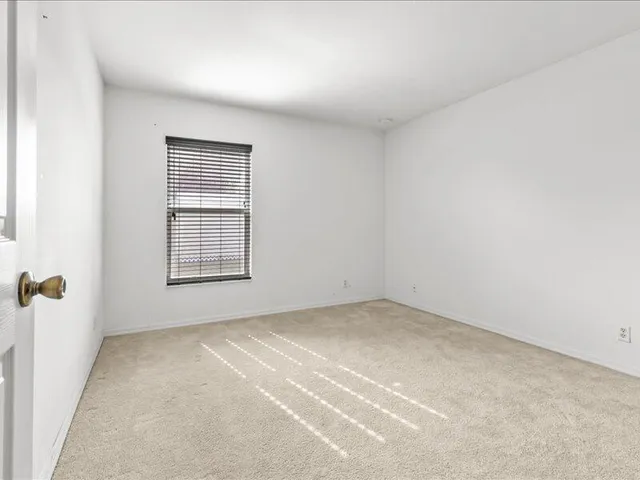 a large white house with a swimming pool