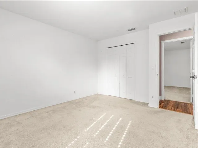 a backyard of a house with yard and outdoor seating