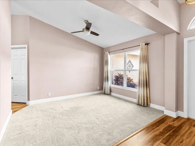 a view of an empty room with a window