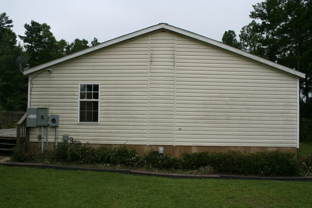 50 Simmons Road Mauk, GA 31058 - Photo 24 of 35 a view of a white house next to a yard