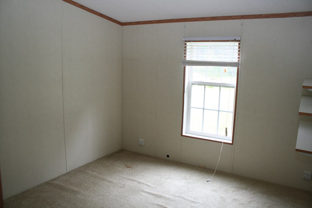 50 Simmons Road Mauk, GA 31058 - Photo 9 of 35 an empty room with a window