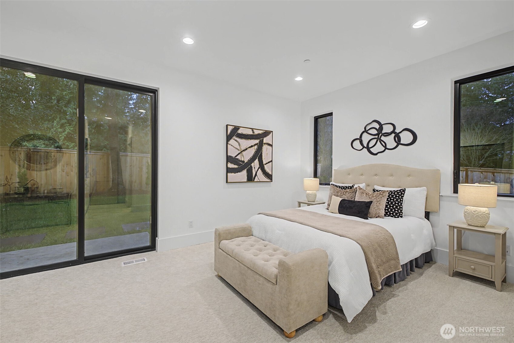 14515 Southeast 20th Place Bellevue, WA 98007 - Photo 16 of 21 a bedroom with a large bed and a chandelier