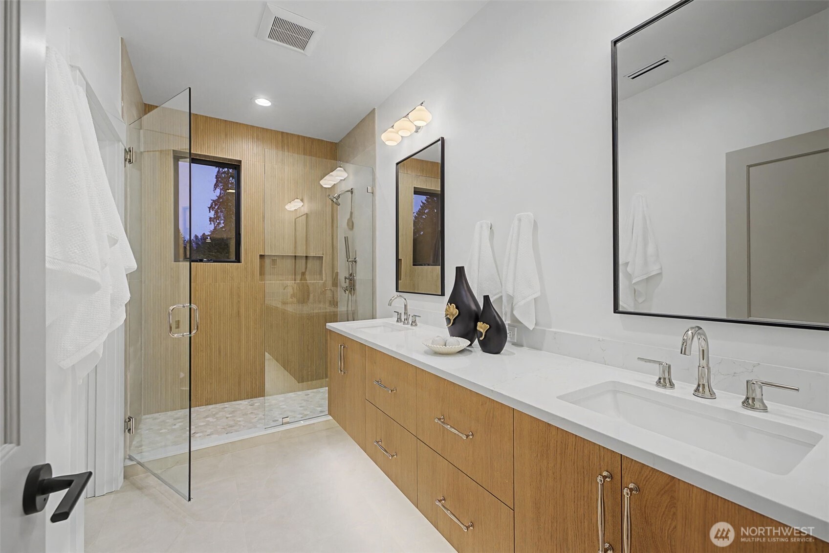 14515 Southeast 20th Place Bellevue, WA 98007 - Photo 17 of 21 a en suite bathroom with double sink and a mirror