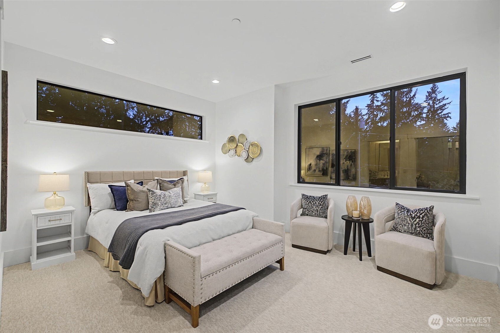 14515 Southeast 20th Place Bellevue, WA 98007 - Photo 18 of 21 a bedroom with a large bed and a large window