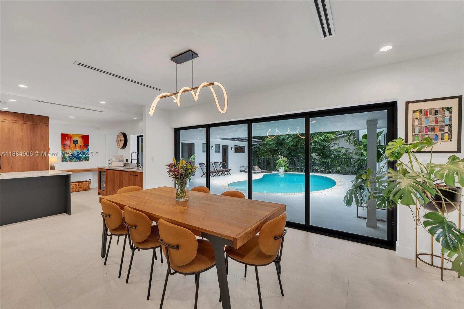 3111 Anderson Road Coral Gables, FL 33134 - Photo 12 of 34 a view of a dining room with furniture window and outside view