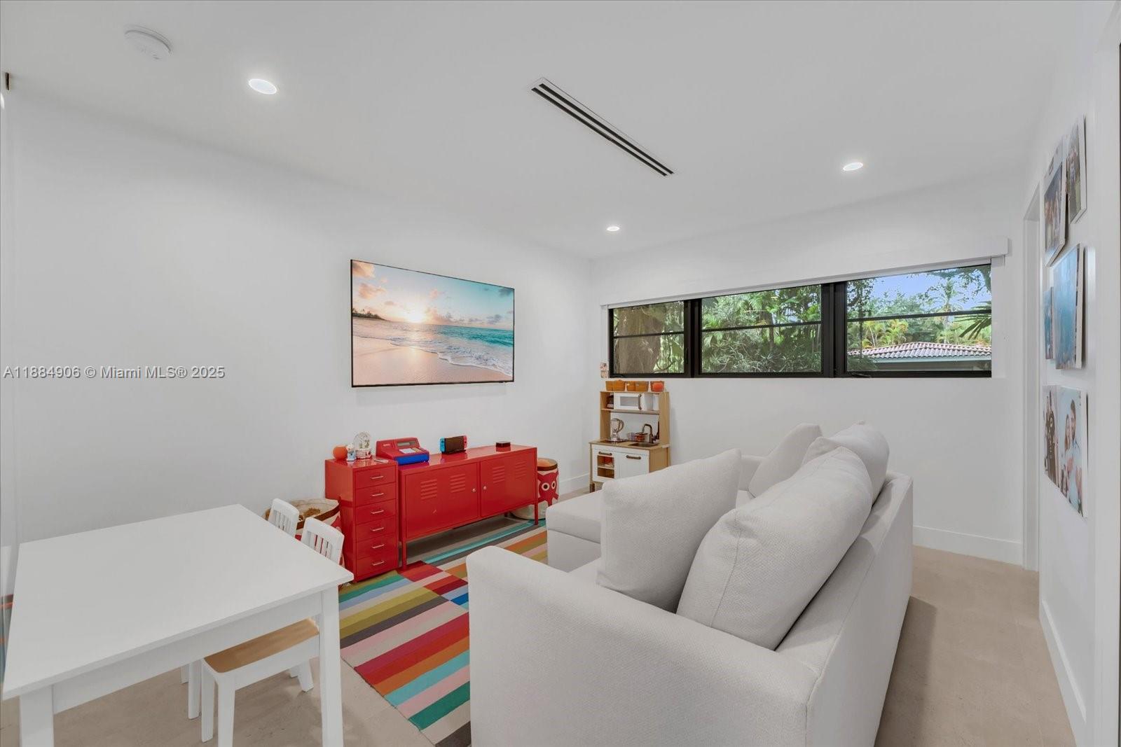3111 Anderson Road Coral Gables, FL 33134 - Photo 14 of 34 a living room with furniture and a painting