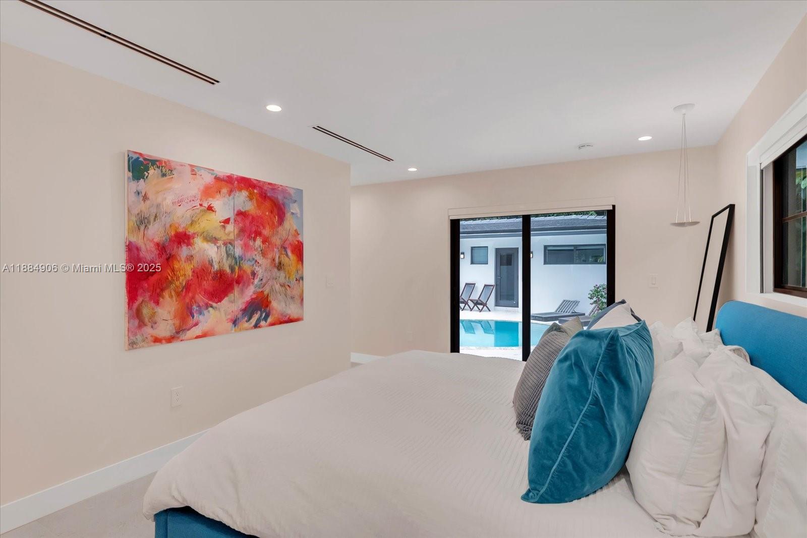 3111 Anderson Road Coral Gables, FL 33134 - Photo 19 of 34 a bed room with a bed and a painting on the wall