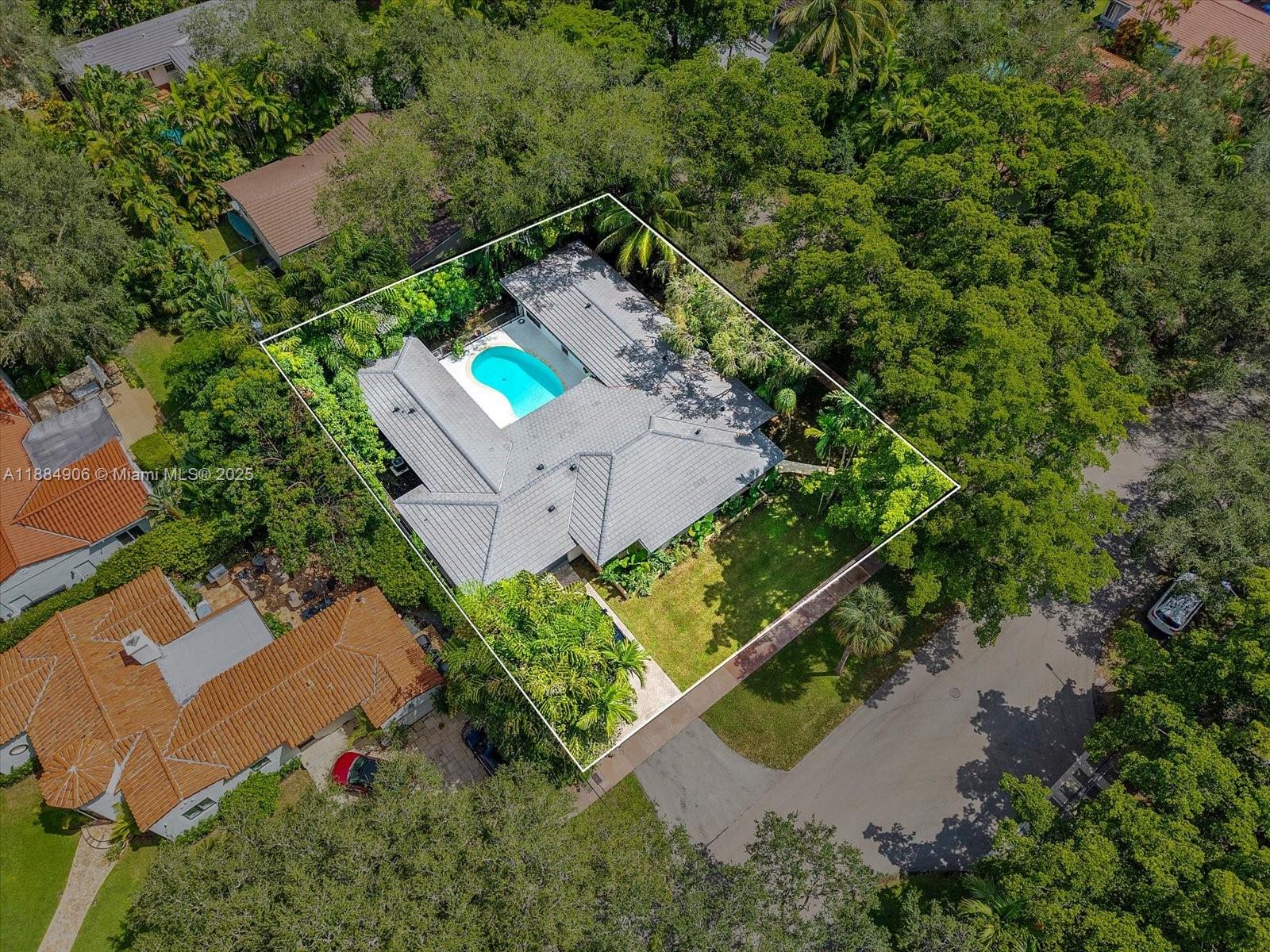 3111 Anderson Road Coral Gables, FL 33134 - Photo 30 of 34 an aerial view of a house with a yard