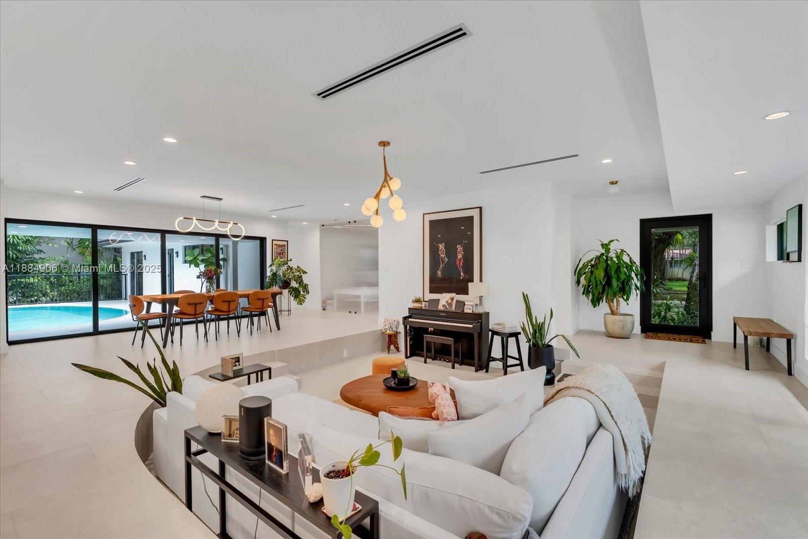 3111 Anderson Road Coral Gables, FL 33134 - Photo 4 of 34 a living room with furniture fireplace and a large window