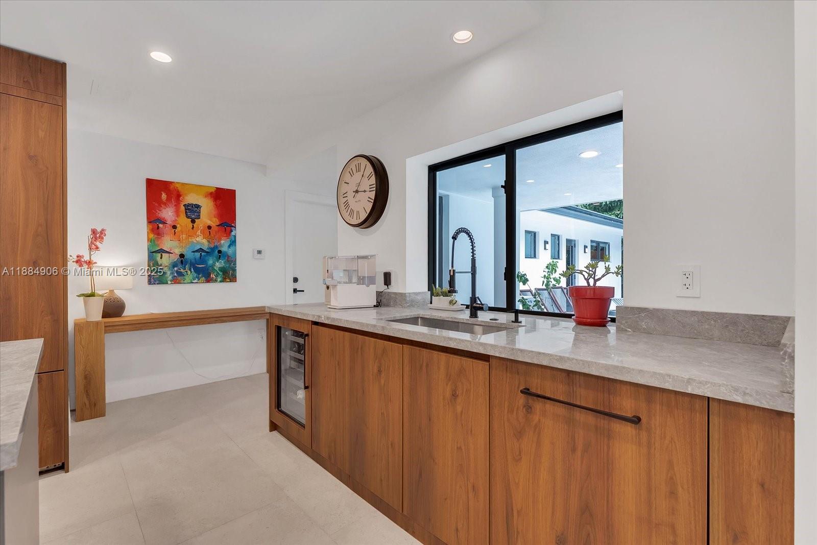 3111 Anderson Road Coral Gables, FL 33134 - Photo 8 of 34 a bathroom with a double vanity sink and a large mirror