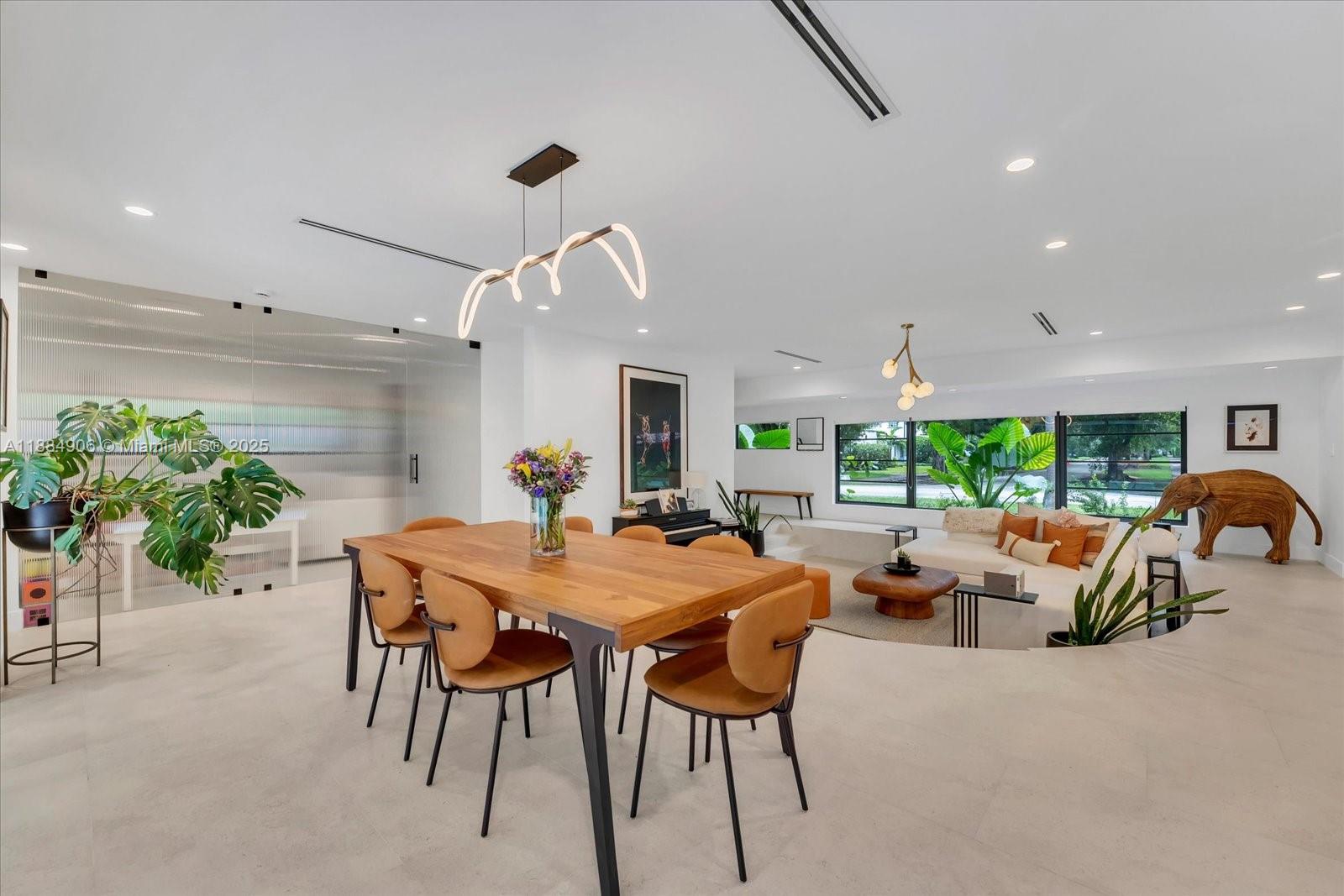 3111 Anderson Road Coral Gables, FL 33134 - Photo 10 of 34 a view of a dining room with furniture and a large window