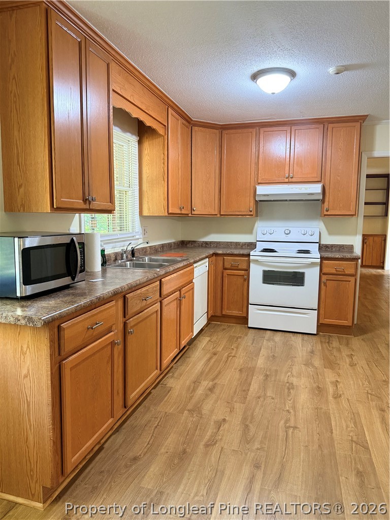 425 Dunmore Road Fayetteville, NC 28303 - Photo 7 of 21 a kitchen with a sink cabinets and stainless steel appliances