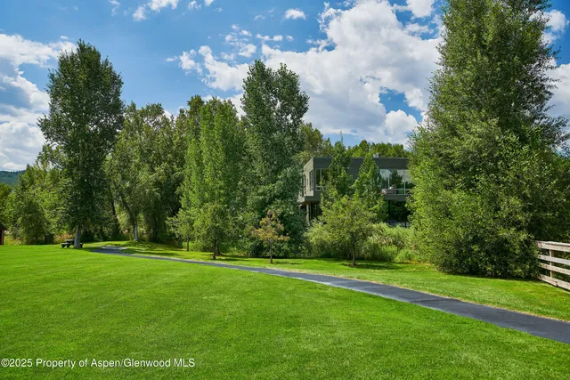 a view of a golf course with a lake