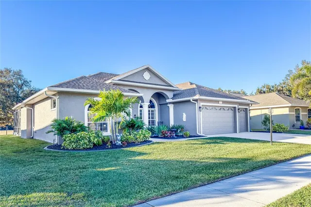 a front view of house with yard and green space