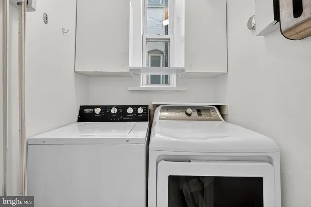 a utility room with dryer and washer