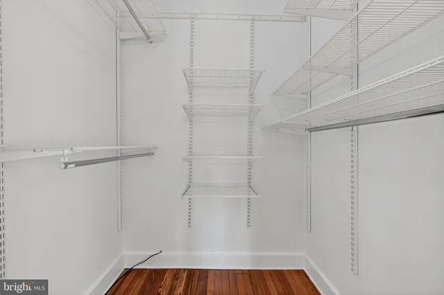 wooden floor fireplace and natural light in room