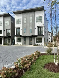 a living room with stainless steel appliances kitchen island granite countertop furniture and a view of living room