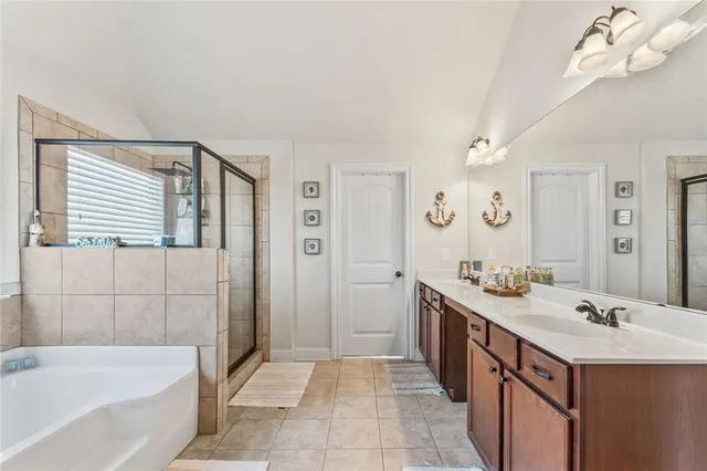 a bathroom with a bathtub and a sink