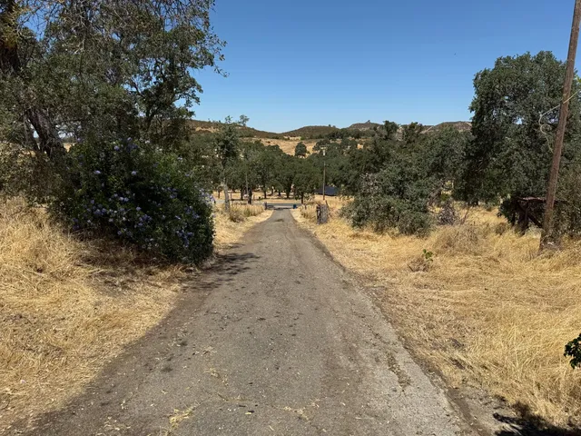 a view of a yard covered with snow