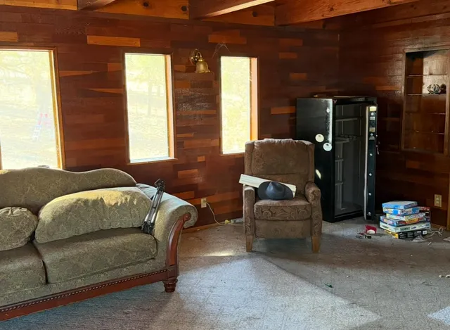 a living room with furniture and a window