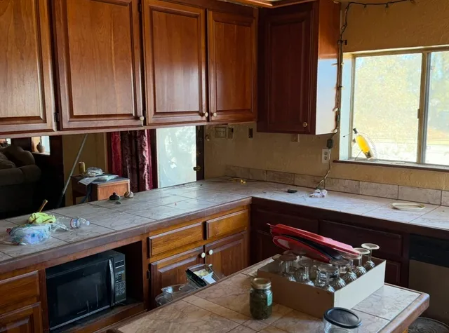 a kitchen with a sink and a window