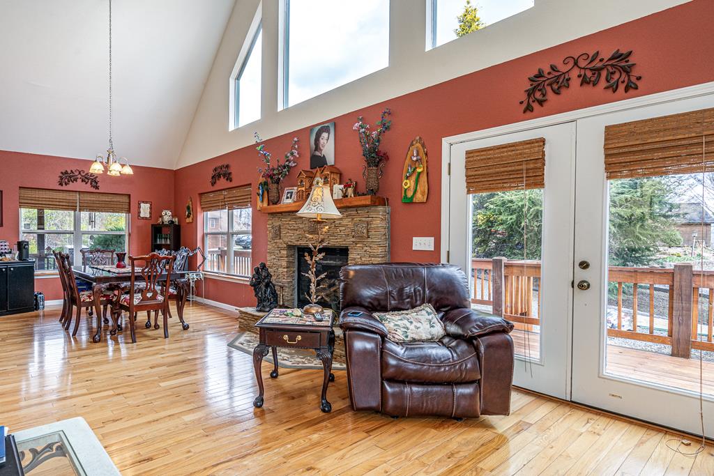 210 Pin Oak Ridge Murphy, NC 28906 - Photo 12 of 51 a living room with fireplace furniture and a large window