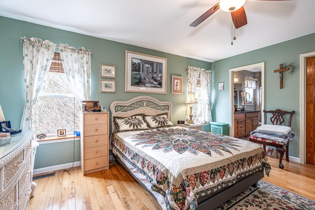210 Pin Oak Ridge Murphy, NC 28906 - Photo 16 of 51 a bedroom with a bed wooden floor and window