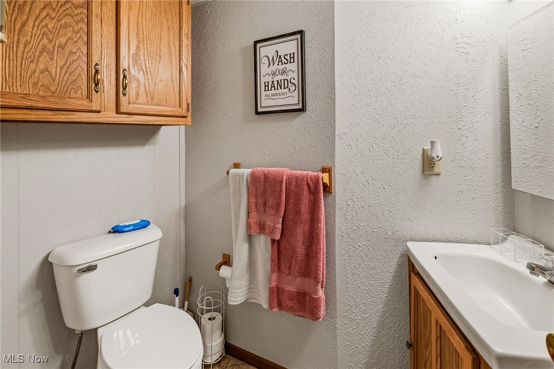 86523 North Bay Road Scio, OH 43988 - Photo 10 of 25 Bathroom featuring a textured wall and vanity
