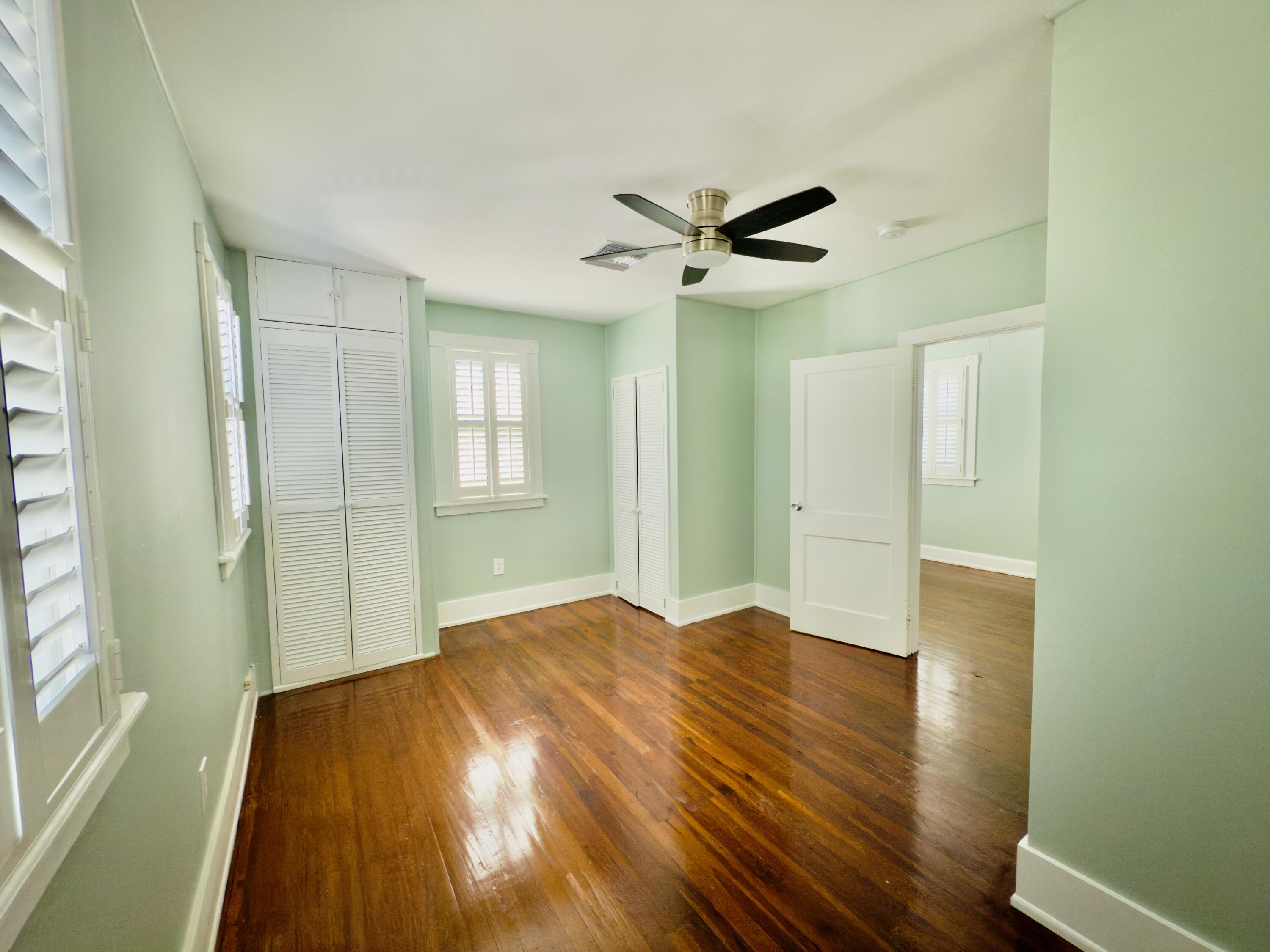 728 Ashe Street Key West, FL 33040 - Photo 16 of 25 a view of empty room with wooden floor and fan